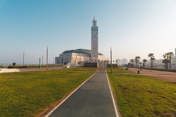 view of Hassan II Mosque from the alley in a bright day