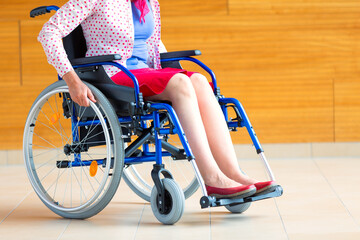 young woman on wheelchair in the medical center - 486767382