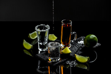 Mexican tequila with lime and salt on stone background. concept luxury drink. Alcoholic drink....
