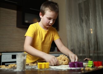 boy making dough in the kitchen