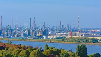 Gordijnen Aerial view on petrochemical industry infrastructure along scheldt river in the port of antwerp, Flanders, Belgium  © Kristof Lauwers