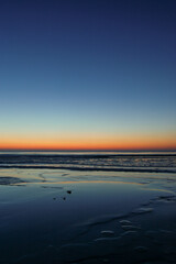 Frozen Baltic sea during a beautiful calm sunset in Liepaja, Latvia