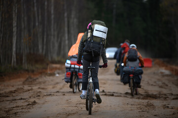 Fototapeta na wymiar Russian bicyclists in the autumn forest, Moscow Region