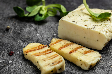 Grilled slices of halloumi cheese with grill marks and mint. Cyprus squeaky cheese. banner, menu, recipe place for text, top view