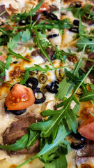 Delicious pizza with arugula and mozzarella.