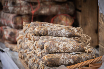 heap of cured sausages in the market