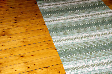 Rug On Wooden Floor