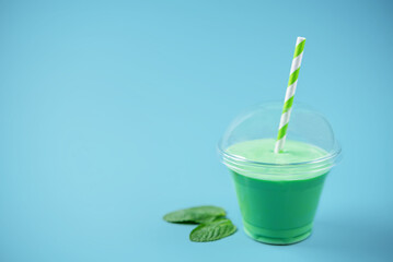 Green milkshake in glass
