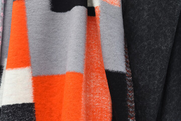 Detailed close up view on samples of cloth and fabrics in different colors found at a fabrics market