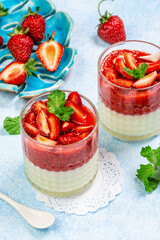 Traditional italian dessert vanilla strawberry panna cotta. vertical image. top view. place for text