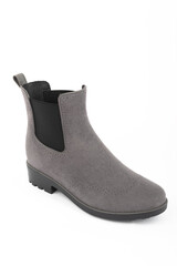 women's rubber boots on a uniform background