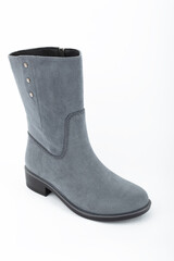 women's rubber boots on a uniform background