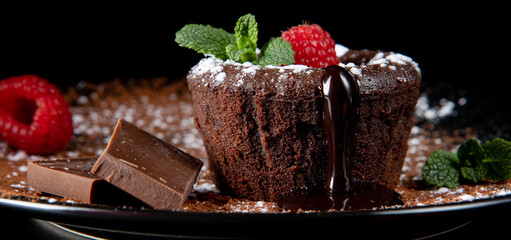Small chocolate cake filled with liquid chocolate. Traditional French dessert coulant. Tasty hot...