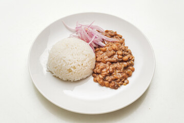Fototapeta na wymiar Lentiles portion served with rice and onion salad.