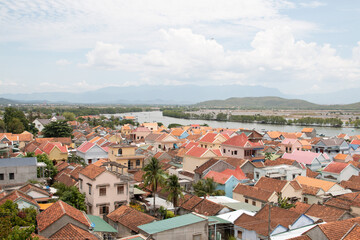 Fototapeta na wymiar Aerial view fishing village. Vietnam. sea and rooftoops