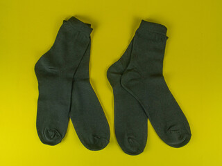 Black socks on a yellow background