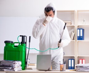 The professional contractor doing pest control at office