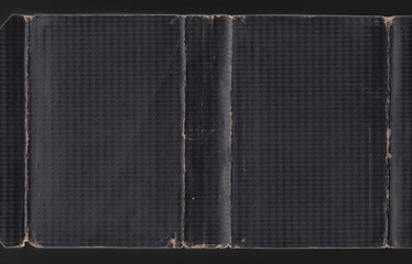 100 year old black book cover. Diamond effect with creases 