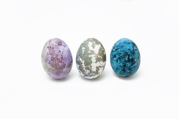 Easter eggs dyed with natural dyes. Multicolored purple, blue and marbled chicken eggs dyed with hibiscus tea.