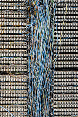 many colourful telephone wires in a switchboard connection box