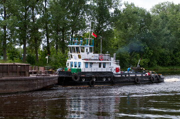 Pusher tug "BT-0661" with barge "R-0494" at the Pina river, Pinsk, Brest region, Belarus, June 15, 2014