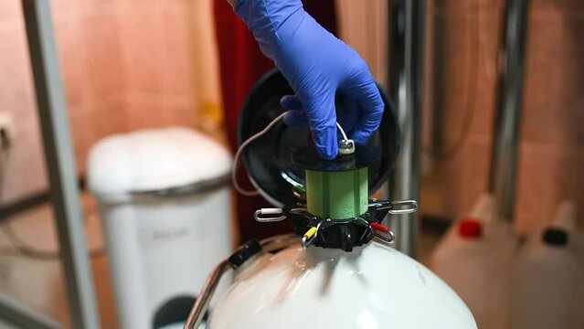 Dewar vessel with liquid nitrogen with frozen embryos and eggs in a cryobank in a modern IVF clinic. Reproductive medicine, in vitro fertilization