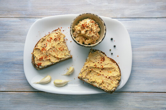 Balkan cuisine. Urnebes - traditional appetizer, type of salad. It is made of white cheese, hot chili pepper and other spices. Rustic table, flat lay. Copy space