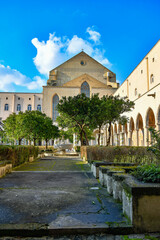 Obraz premium The inner courtyard of the monastery of Santa Chiara, decorated with 17th century painted majolica in Naples, Italy.