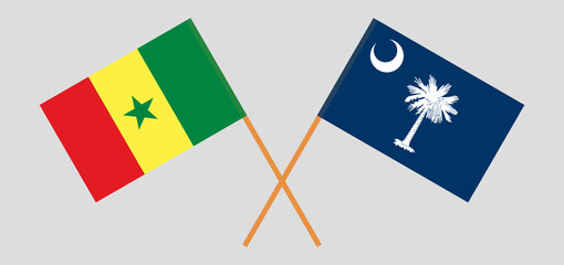 Crossed flags of Senegal and The State of South Carolina. Official colors. Correct proportion