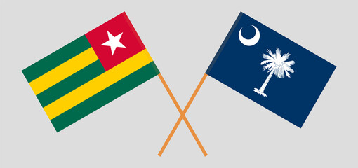 Crossed flags of Togo and The State of South Carolina. Official colors. Correct proportion
