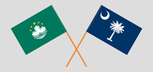 Crossed flags of Macau and The State of South Carolina. Official colors. Correct proportion