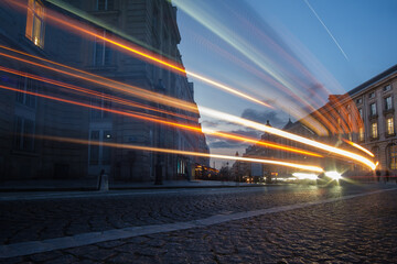 Light trails from cars and motorbikes on a busy boulevard in Paris France