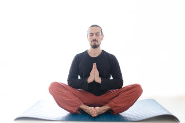 Man in peace with calm mood in meditation trance. Includes copy space, interior shot with professional performer.