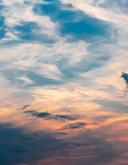 The blue sky with an orange tint at sunset looks the most beautiful. The texture of the sky with clouds