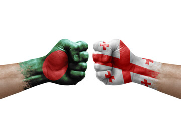 Two hands punch to each others on white background. Country flags painted fists, conflict crisis concept between bangladesh and georgia