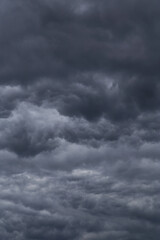 Storm sky with dark grey cumulus clouds background texture, thunderstorm