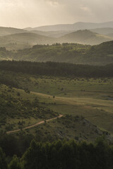 Obraz premium View of the distant hills in the early morning light, Pešterska visoravan