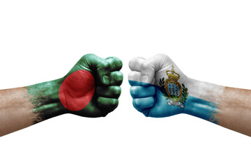 Two hands punch to each others on white background. Country flags painted fists, conflict crisis concept between bangladesh and san marino