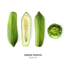 Creative layout made of green papaya on white background. Flat lay. Food concept. Macro concept.