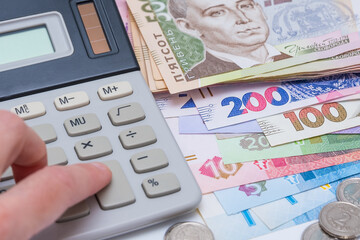 Ukrainian hryvnia, background. Concept of receiving a salary, pension, inflation, deposit and credit. 