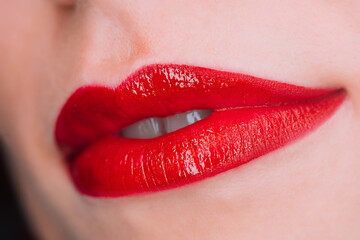 Obraz premium Glossy passionate red lips. Woman with liquid lipstick or gloss. Shiny smile. Lady with natural lip 