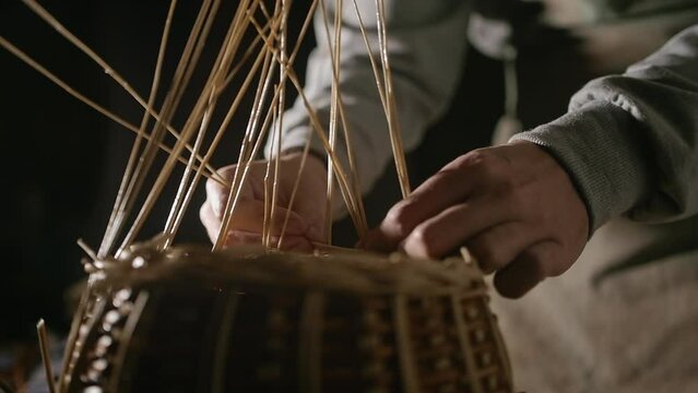 weaving a basket from willow branches