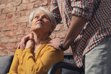 Obraz premium Old Senior Caucasian Woman With Dementia Getting Support And Care. High quality photo