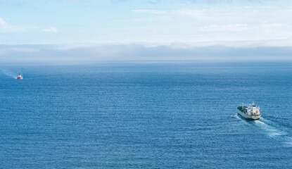 Passing freighters in the sea
