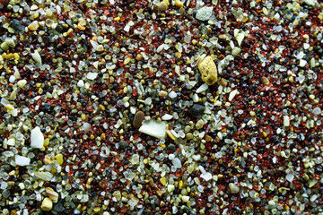 Texture of dry red clay with stones close-up