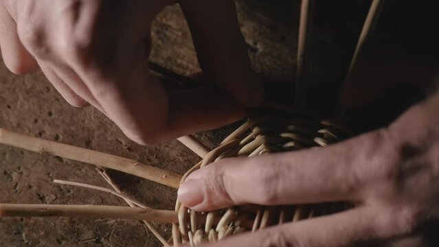 weaving a basket from willow branches