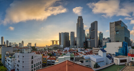Naklejka premium Singapore sunrise city skyline at Boat Quay and Clarke Quay waterfront business district