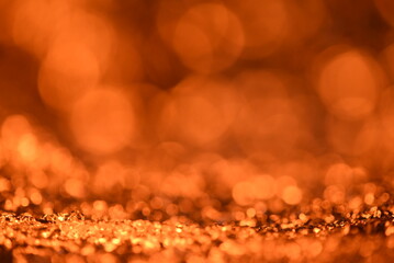 Orange glitter lights texture. Abstract christmas background.