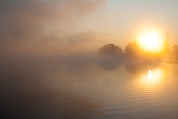 Fog over the lake at dawn 