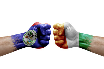 Two hands punch to each others on white background. Country flags painted fists, conflict crisis concept between belize and ivory coast